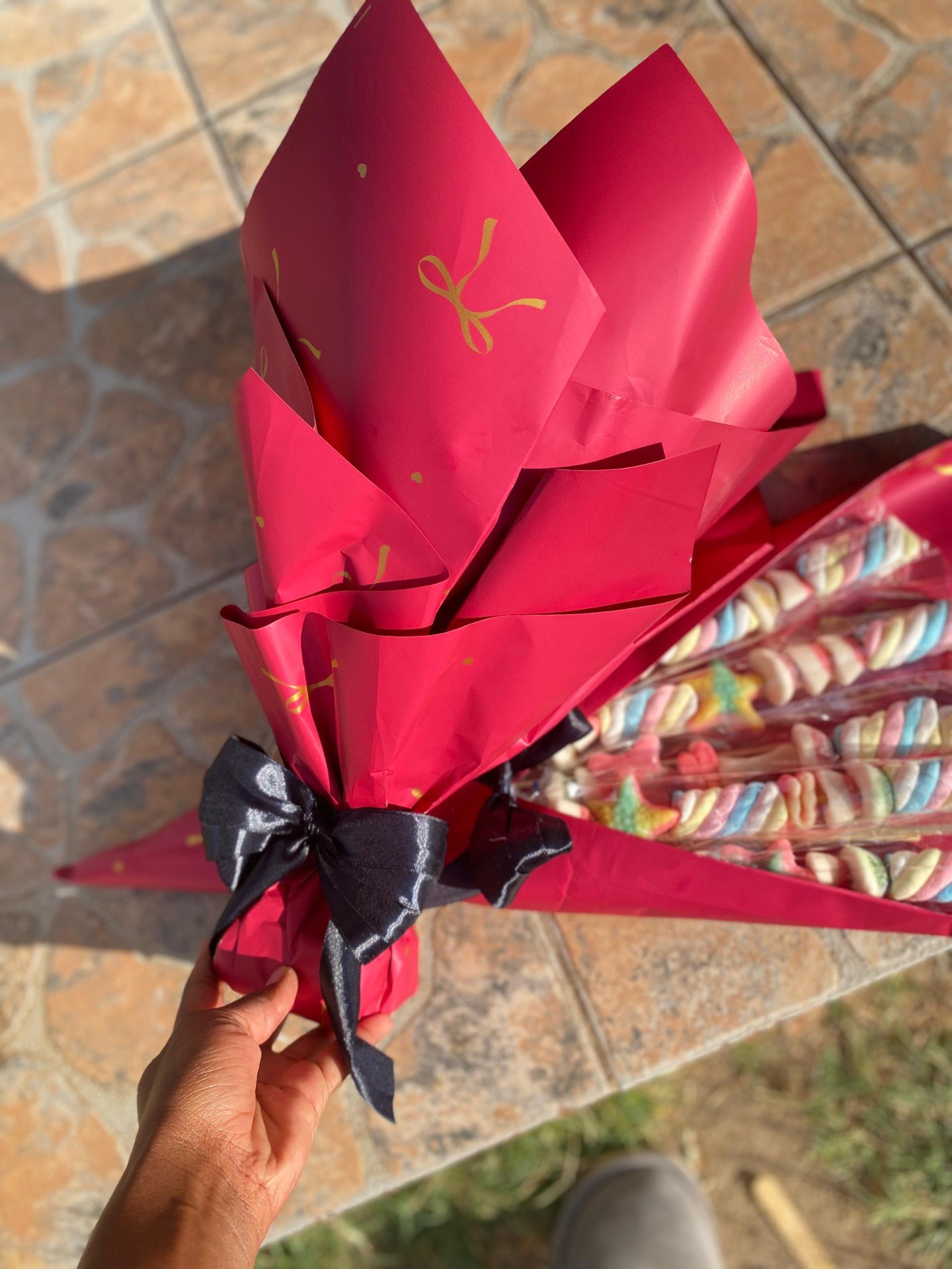 Red bouquet with black ribbon and marshmallow skewers